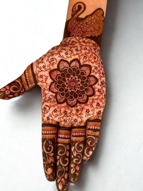 Traditional Indian Mehndi design on both palms showcasing intricate architectural motifs resembling royal palace arches and domes, complemented by detailed peacock patterns on the fingers, with floral and geometric elements throughout.