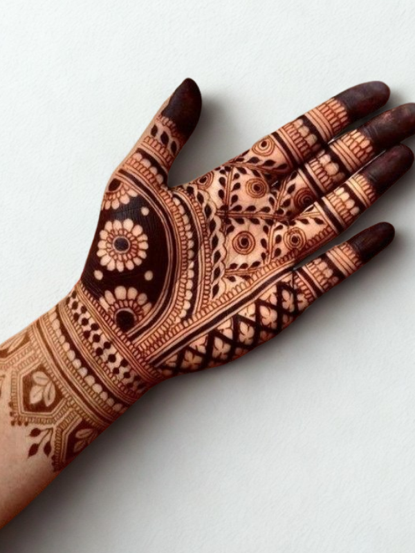 Intricate floral mehndi design covering both hands, featuring bold rose patterns with delicate leafy vines and detailed finger motifs.