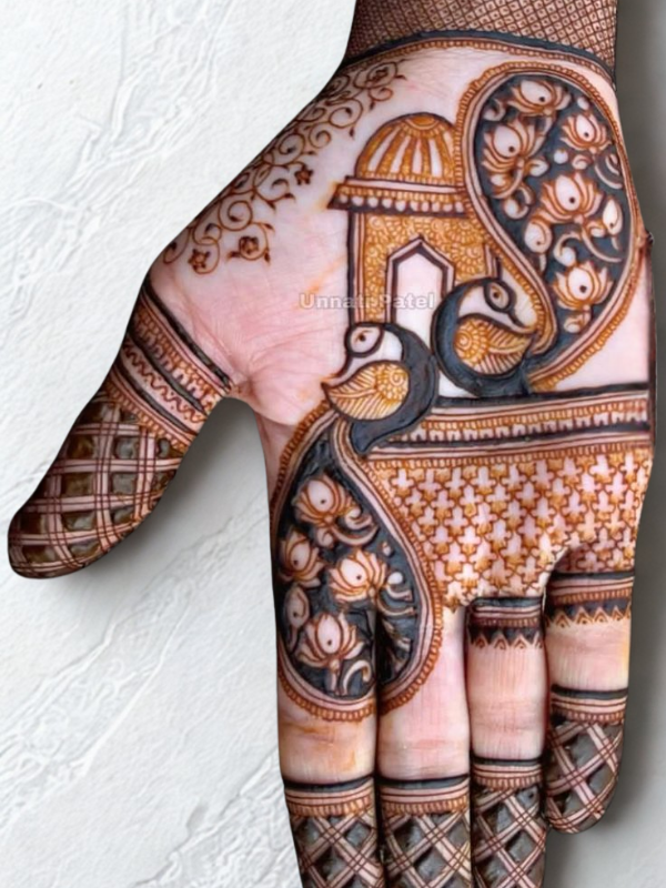 Bridal hands adorned with intricate Kalash-themed Mehndi design featuring traditional pot motifs, floral patterns, and detailed linework on the palms and fingers