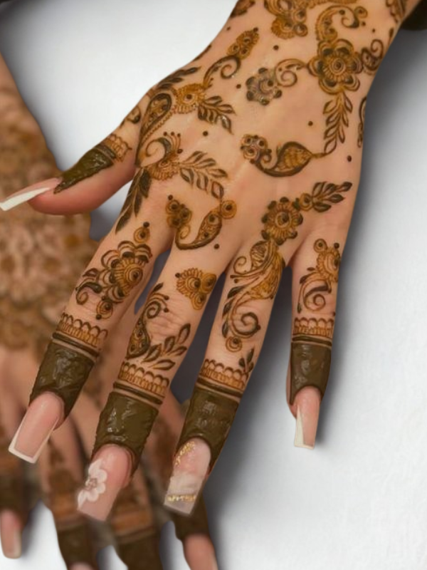 Intricate Mehndi design on the palm featuring a large central mandala with a butterfly motif, surrounded by fine floral and paisley patterns, with additional small butterfly and geometric accents on the fingers and wrist.
