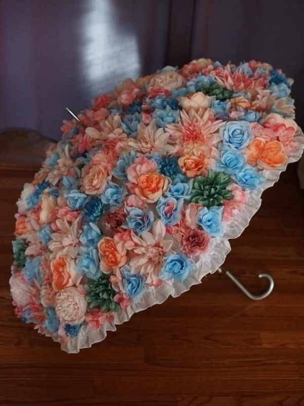 colorful floral bridal umbrella for birde entry in orange and blue flowers